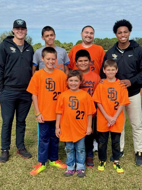 ASD athletes participating in a community baseball clinic
